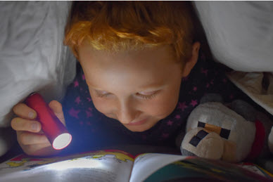 child reading in his room